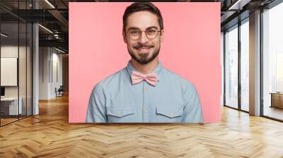 delightful attractive male with mustache and beard dressed in festive clothes, happy to come on frie Wall mural