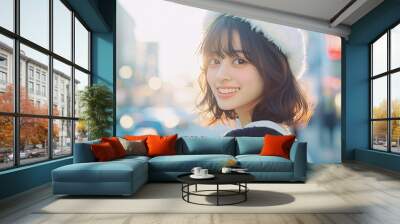 a young Japanese woman with a soft smile and white hat. Her eyes are looking directly at the camera. Wall mural