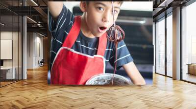 Little boy baking chocolate cake homemade Wall mural