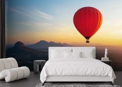 A beautiful sunrise landscape with a red hot air balloon in sky Wall mural