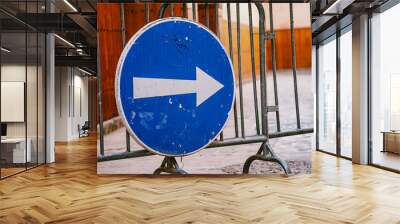 A Blue One Way street sign with a white arrow Wall mural