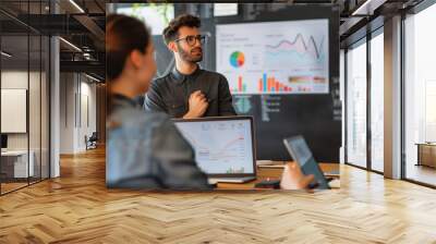 A person measuring business results and communicating it to their team in the boardroom Wall mural