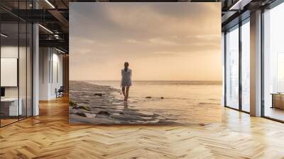 Woman at Sunset on the Beach Wall mural