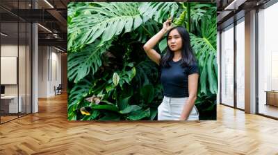 Young Woman Among Tropical Foliage Wall mural