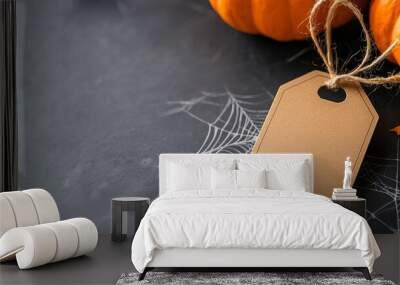 Blank brown tag with pumpkins and spider web on chalkboard background, perfect for Halloween-themed messages or invitations. Wall mural