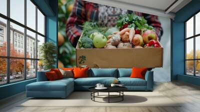 Person Holding a Box of Fresh Produce Wall mural