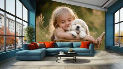 Adorable Little Girl Lovingly Cuddles a Fluffy Puppy in a Basket Wall mural