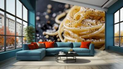 Black Background Closeup of Delicious Cacio e Pepe Spaghetti Dish with Rich Cheese and Pepper Wall mural