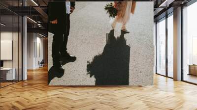 bride and groom walking Wall mural