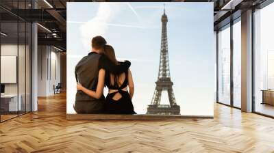 Couple looking at Eiffel tower, romantic date in Paris. Honeymoon, travel to France Wall mural