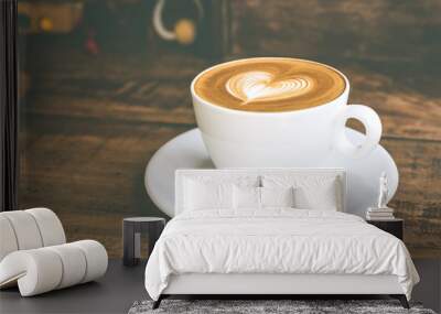 Close up white coffee cup with heart shape latte art on wood tab Wall mural