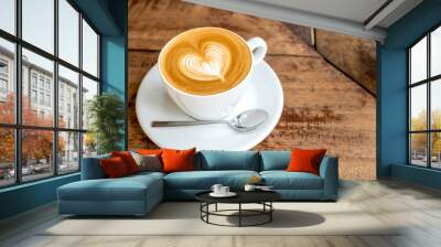 Close up white coffee cup with heart shape latte art on wood tab Wall mural