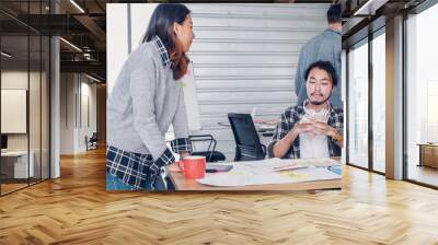 creative designer team argument at casual meeting table and walk out from meeting in modern office.tea,m conflict concept Wall mural