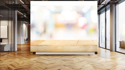 Empty wood table top with blur department store boekh background,Mock up template for display or montage of product or content use as banner in social media ads. Wall mural