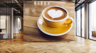 hot cappuccino coffee cup on wooden tray with heart latte art on wood table at cafe,Banner size food and drink concept. Wall mural