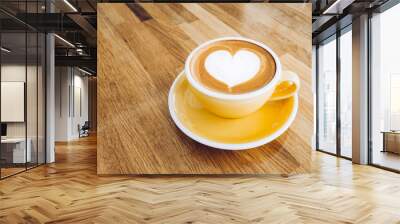 hot cappuccino coffee cup on wooden tray with heart latte art on wood table at cafe,Banner size food and drink concept. Wall mural