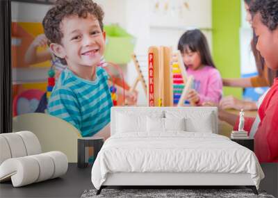 Kindergarten students smile when playing toy in playroom at preschool international,education concept Wall mural