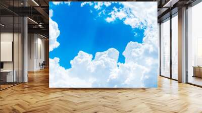 Looking up at Big white cloud and light ray behind cloud with bl Wall mural