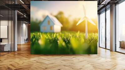 A serene landscape featuring a house and a wind turbine basking in the glow of golden sunlight, symbolizing sustainable living. Wall mural