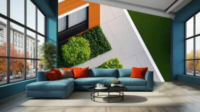 Aerial view of a modern house with vibrant greenery, showcasing contemporary architecture and landscaping design. Wall mural