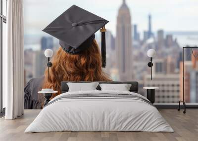 Graduate gazing at city skyline in cap and gown, symbolizing achievement and future possibilities Wall mural