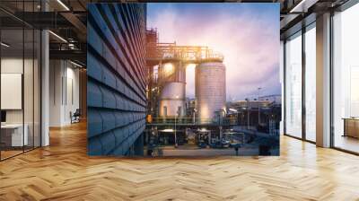 Chemical tanks in petrochemical industry plant or Reactor for chemical reaction in factory with blue sky sunset background Wall mural