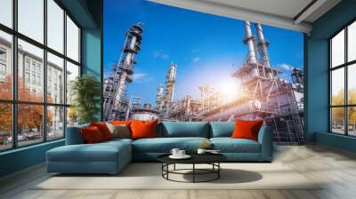 Industrial furnace and heat exchanger cracking hydrocarbons in factory on blue sky background, Close up of equipment in petrochemical plant Wall mural