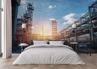 Pipeline and pipe rack of petroleum industrial plant with sunset sky background Wall mural