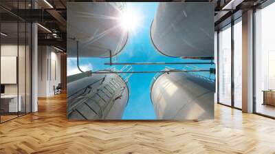 Stainless tanks and pipeline for liquid chemical industrial on blue sky background Wall mural