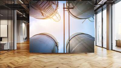 Stainless tanks and pipeline for liquid chemical industrial on sky background Wall mural