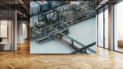 Waste water treatment pit with submersible pump Wall mural