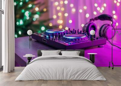 A vibrant DJ console with headphones, illuminated by colorful lights, creating an energetic party atmosphere. Wall mural