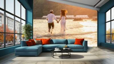 Asia couple on the beach. Wall mural