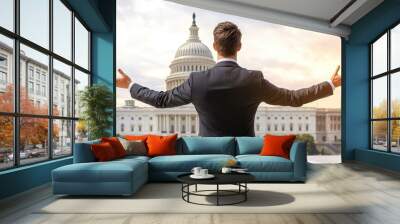 Confident businessman with arms wide open, front of government building, sunset sky in background. Wall mural