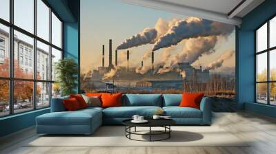 industrial factory with many tall smokestacks. Thick smoke billows into the sky. It is winter, and the ground is partly covered with snow Wall mural