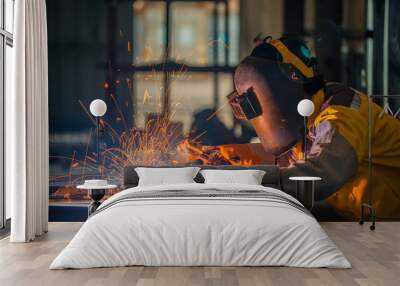 Worker welding the steel part by manual Wall mural