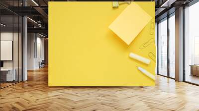 yellow note pad stick on yellow paper  and yellow stationery equipment  , copy space. Wall mural