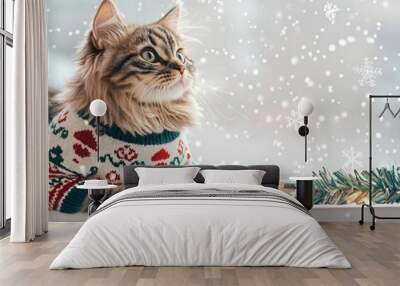 A fluffy cat in an ugly sweater with snowman patterns, sitting on a windowsill watching snow fall, holiday garland and lights framing the scene, Ultra HD, copy space for text Wall mural