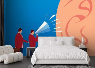 Two businessmen shouting at the huge ears with a megaphone Wall mural