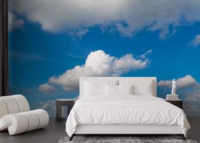 A blue sky with white clouds Wall mural