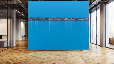 Line of houses on river quay bay geometric horizon dramatic twilight Wall mural