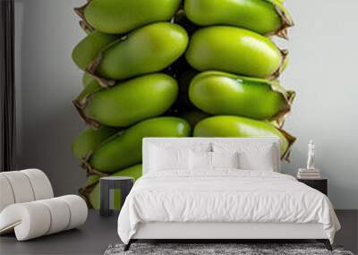 Stack of fresh green bananas, white background Wall mural