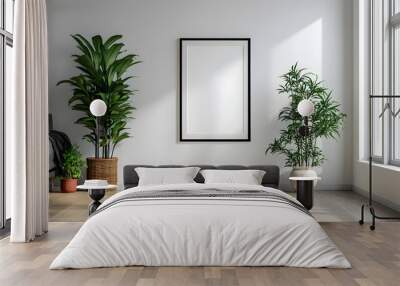 Minimalist living room interior with a black framed mockup poster, two potted plants, a window, and a couch. Wall mural