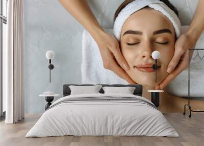 
Close-up portrait of a beautiful woman with closed eyes and a towel on her head lying down at a spa salon, in the style of copy space for text  Wall mural