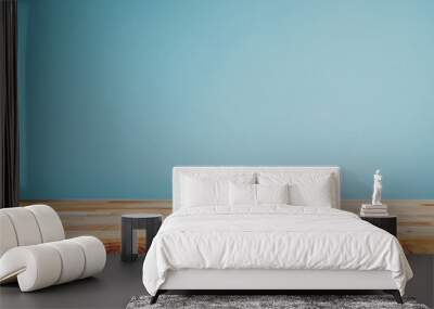 Wooden table top with a pastel blue background for a product display presentation concept, an empty and clean wood board on a color wall minimalism background  Wall mural