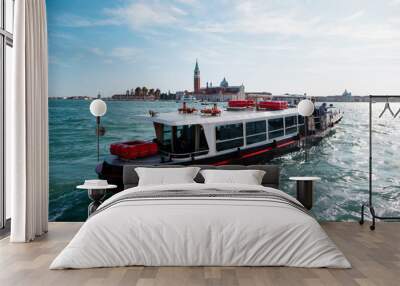 Small tourist ship in the sea near Venice. Transportation of tourists on a warm sunny day. Italy Wall mural