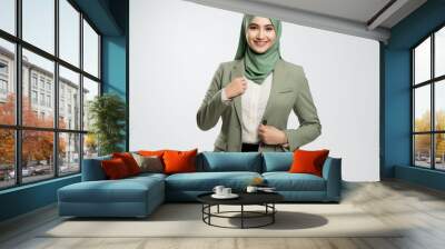 Portrait of a happy confident muslim business woman on background, Beautiful business woman with hijab portrait on white background Wall mural