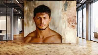 Muscular man posing shirtless against an artistic, textured backdrop, showcasing strength and intensity, the image captures a blend of physicality and artistic expression. Wall mural