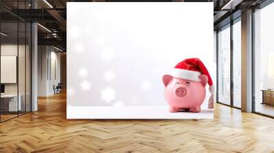 pink piggy bank with Santa hat and copy space Wall mural