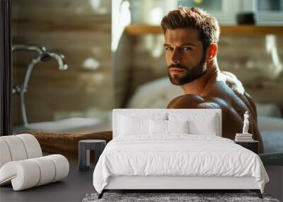 portrait of handsome muscular man sitting in a bathtub Wall mural